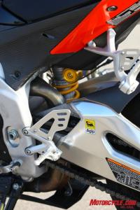 2010 literbike shootout aprilia rsv4 factory vs ducati 1198s vs ktm rc8r , Accessing some of the adjusters on the Aprilia s shock is downright difficult when compared to reaching to fiddle with the KTM s WP shock