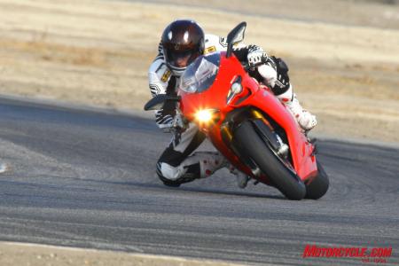 2010 literbike shootout aprilia rsv4 factory vs ducati 1198s vs ktm rc8r , The Ducati requires more initial effort to turn but once in the corner its stability is excellent
