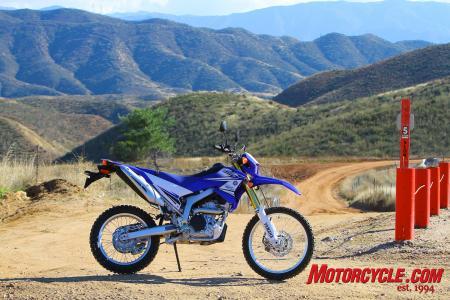 2011 yamaha wr250r review motorcycle com, At Rowher Flats OHV area our Yammi is shown just prior to getting muddy Lights turn signals mirrors horn and EPA approved catalyst equipped muffler make it street legal The alloy framed 28 hp thumper with 10 6 inches F R travel is a trail worthy package