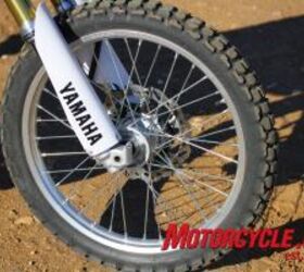 2011 yamaha wr250r review motorcycle com, The 21 inch front on off road knobby is stopped by a single piston caliper squeezing a 250mm slotted wave rotor