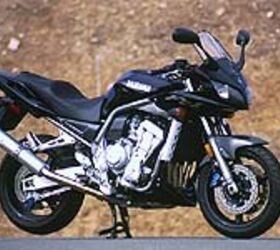 2001 yamaha fz 1 hop up motorcycle com, The chin spoiler adds a much needed accent to the front of the bike as does the taller windscreen that keeps the rider in cleaner air Out back an aluminum GYT R slip on exhaust canister sets off the black bodywork
