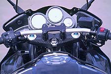2001 yamaha fz 1 hop up motorcycle com, The lower handlebar clamps and titanium handlebar conspire to make the ergos a tad sportier and for some more comfortable Prodigious application of carbon fiber makes the pilot s view much more pleasing to the eye while shaving some high placed weight