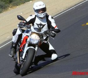 2010 triumph street triple r vs 2011 ducati monster 796 shootout motorcycle com, Editor Jeff Cobb demonstrates the Monster chassis combination of agility and stability