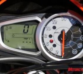 2010 triumph street triple r vs 2011 ducati monster 796 shootout motorcycle com, The Triumph s large analog tachometer joined by an easily read LCD readout is preferable to the Ducati s smaller all LCD display