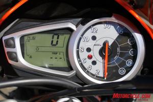 2010 triumph street triple r vs 2011 ducati monster 796 shootout motorcycle com, The Triumph s large analog tachometer joined by an easily read LCD readout is preferable to the Ducati s smaller all LCD display