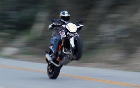 2013 ktm 690 duke review video motorcycle com, Things quickly get blurry when a torquey motor combines with a lightweight chassis It s just short on wheelieing while accelerating full stick in second gear but that s easily changed with a whiff of the clutch or a small bump in the road