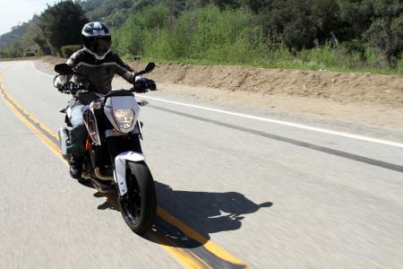2013 ktm 690 duke review video motorcycle com, Even Duke s small chest presents a big impediment to highway speed air while aboard the 690 Duke