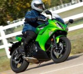 2012 kawasaki ninja 650 review first ride video motorcycle com, The Green Ninja 650 features matte black airbox covers and a silver painted shock spring The red Ninja has color matched covers and a red shock spring for the same MSRP