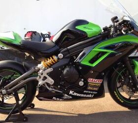 2012 kawasaki ninja 650 review first ride video motorcycle com, The race prepped Ninja 650 is strikingly aggressive Note the linear arrangement of the Ninja s new chassis with an unbroken line stretching from the steering head to the tip of the cool tubular swingarm