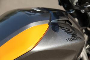 motorcycle beginner year 2 2013 honda nc700s review, We appreciated the capacious storage area under the faux fuel tank but its appearance would be more attractive if its lid would fit flush against its seam
