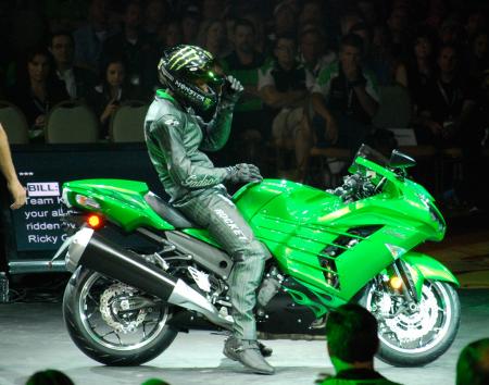 2011 kawasaki dealer meeting report video, Kawi execs spent a lot of time unveiling various programs to assist dealers with sales ordering inventory and plans for advertising but the all new ZX 14R was received with as much enthusiasm as anything discussed during the presentation Here multi time drag champ Rickey Gadson rides the big Ninja on to center stage