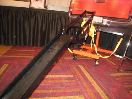 2010 indy dealer expo report, Cycle Hitch brings a new take on bike transport with this hitch mounted carrier that can hold up to 1200 pounds by letting a bike s rear tire roll on the road behind a vehicle