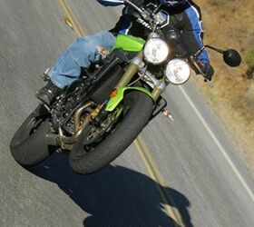 2008 triumph street triple 675 review motorcycle com, Woooo yeah Easy front end lifts are a hallmark of this hooligan making motorcycle