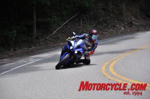2010 yamaha r1 r6 forum convention at deals gap, Shane McCoy shows how they do it at the Gap on his Graves Motorsport equipped 09 R1 You d never think he hadn t yet replaced half worn out stock tires given how close to the ground his high mounted rear sets could get Photo by Logan Gastio