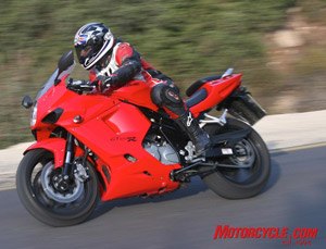 hyosung gt650r review motorcycle com, The asymmetrical mounting of the silencer will cause the Hyosung to tip right if left unattended Yossef notes