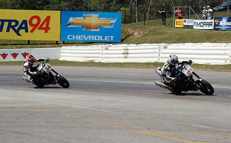 motorcycle beginner year 2 up close with canadian superbike racing, Just like in the AMA the Canadian Championship includes a Harley Davidson XR1200 racing series Reigning champion Steve Crevier holds off Michael Barnes exiting the final corner