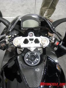 2011 erik buell racing 1190rs preview motorcycle com, The cockpit of the 1190RS shows off the billet aluminum triple clamp holding an Ohlins fork LCD gauge panel is from AIM