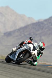 2011 triumph daytona 675r review first ride motorcycle com, Leaned over on the racetrack is the 675R s natural environment