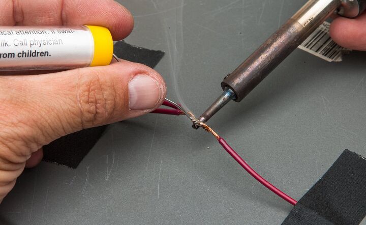 turn on how to install switched accessory power to your motorcycle, An example of ideal iron wire and solder placement The heat is transferred to the wire which in turn heats the solder to its melting point