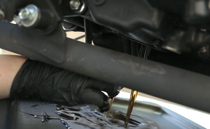 i mo i wrenching how to change your oil video, Used motor oil contains known carcinogens Wear protective gloves Also make sure your arm is in a position that prevents hot oil from running down it as it pours out of the engine