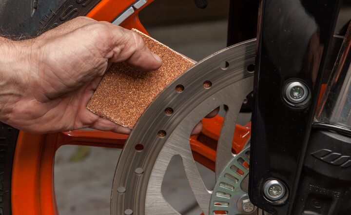 i mo i wrenching how to replace brake pads, Clean the disc of any built up pad material with sandpaper