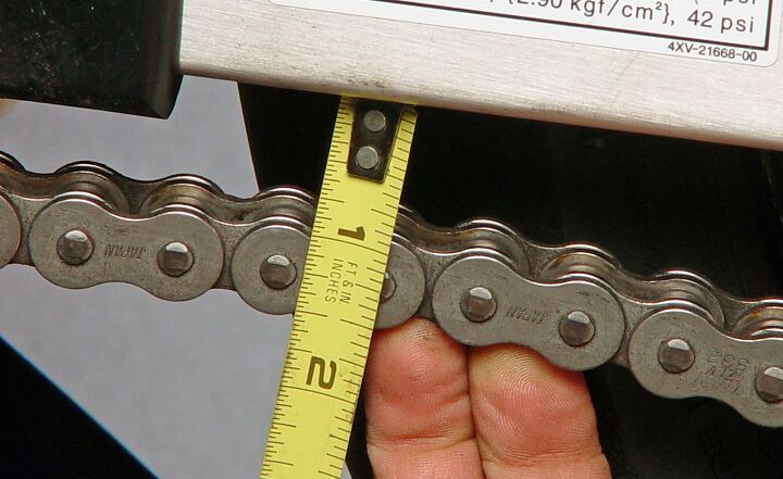 how to adjust a motorcycle chain, Once you ve adjusted your chain a few times you ll get the feel for when it is loose but the only way to be certain is to use a tape measure