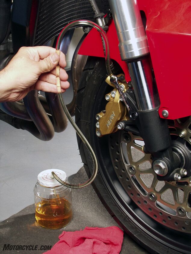 mo wrenching how to bleed your brakes, Keeping a big arch in the line will keep bubbles from being drawn back into the caliper Don t be stingy with your fresh fluid Keep pumping it through the system after you think you re done Some bubbles are tenacious