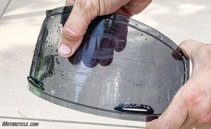 how to clean a motorcycle helmet, Make sure that you have lots of soap and water to clean your visor It cuts through the bug guts and acts as a lubricant between your fingers and the visor