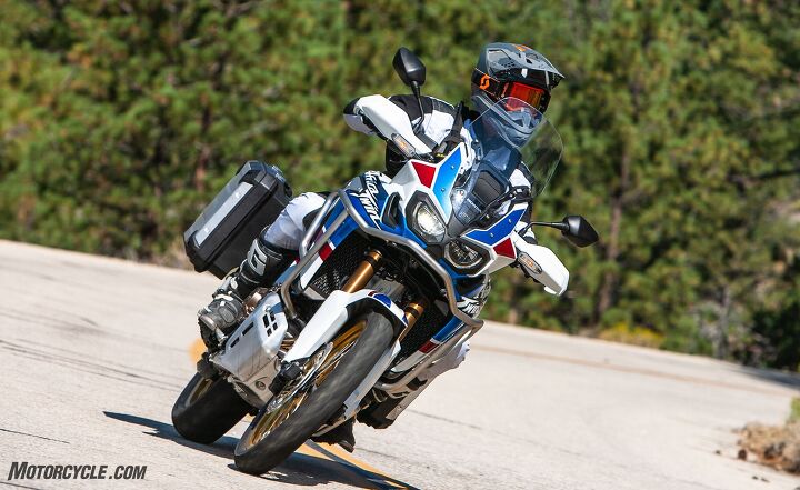 2018 big bore adventure touring shootout part 1 street, From wind and rain to heat and cooler temperatures the AT AS has great weather protection for its rider that comes standard The Adventure Sports windscreen is 3 1 inches taller than the standard Africa Twin and the handguards not only look cool but they offer added safety too