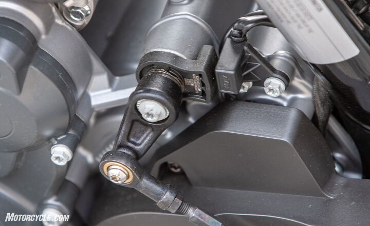 the clash of two super middleweights ktm 890 duke r vs triumph street triple rs, KTM tells us the shifting issues we were having are rooted in the quickshifter calibration software not anything mechanical Here you see the quickshifter mechanism on the 790 Duke which didn t give us any problems