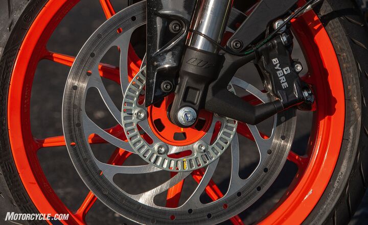 lightweight rippers 2019 ktm 390 duke vs 2019 kawasaki z400, This picture sums up the KTM s component advantage pretty well An inverted 43mm WP fork radial mount ByBre caliper and 320mm disc are all more stout than its Team Green counterpart s parts