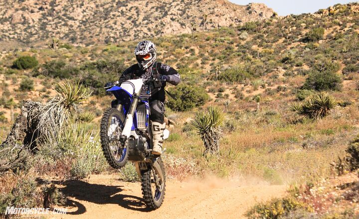 a tale of two enduros 2019 honda crf250rx vs 2019 yamaha yz250fx, Our guest tester demonstrating the ease with which the Yamaha s torque lofts the front end