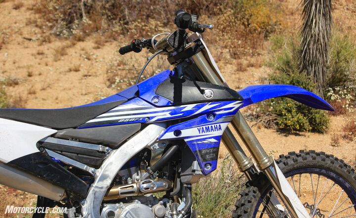 a tale of two enduros 2019 honda crf250rx vs 2019 yamaha yz250fx, Yamaha was laser focused on delivering the best mass centralization possible which is evident by the rearward slanted engine and under seat fuel tank Where the gas cap normally would be is a toolless cover to access the air filter