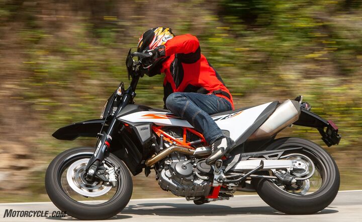 supermoto two ways, My elbows may be up dirtbike style but my butt s scooted back sportbike style With the KTM s fuel giving the bike a rearward weight bias at least from the saddle dirt riders who sit forward and stick their foot out might feel more comfortable on it than I did