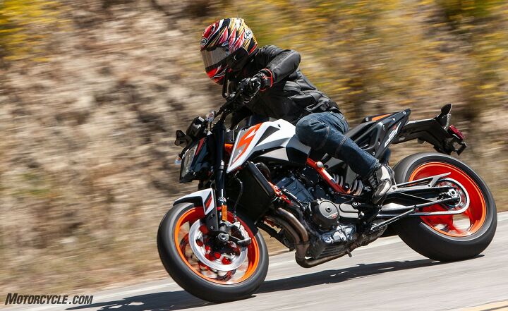 the clash of two super middleweights ktm 890 duke r vs triumph street triple rs, In comparison you can see on the KTM how much room is left on the seat behind the rider Lower pegs are more comfortable and the standard placement of the bars they re adjustable place the rider in a slight cant to cut through the wind easier