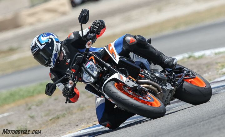 the clash of two super middleweights ktm 890 duke r vs triumph street triple rs, Wider bars on the KTM give you the leverage to bend the bike to your will
