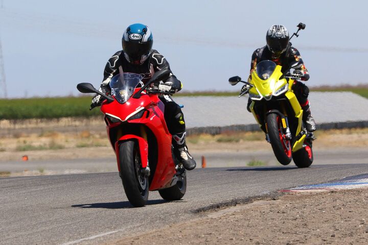 2021 aprilia rs660 vs ducati supersport 950s, The Aprilia kinda feels like a young rambunctious puppy jumping up and down and nipping at the old Ducati s flanks and wanting to play says John