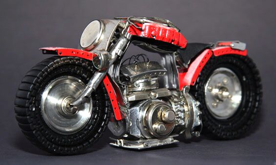 sculpted motorcycles out of watch parts