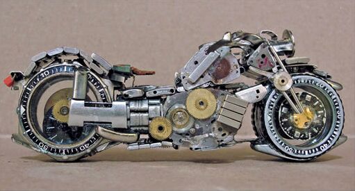 sculpted motorcycles out of watch parts