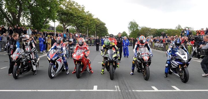 8/6/2011. PACEMAKER BELFAST. MotoGP star Nicky Hayden alongside former world champion Mick Doohan, MotoGP's Cal Crutchlow, TT legend Iain Hutchinson and BSB rider Josh Brooks walk up Glencrutchery Road ahead of their parade lap at the Isle of Man TT races on Wednesday. Picture Charles McQuillan/Pacemaker.