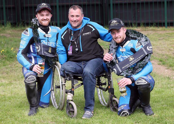 Nick Crowe (center), flanked by his sons Ryan (left) and Callum after they finished second in the first Sidecar race. Father Crowe was himself an accomplished TT competitor, winning five times before a crash in 2009 resulted in the loss of his right arm and right leg below the knee. Despite his injuries, he’s an ardent supporter of his sons’ racing careers.