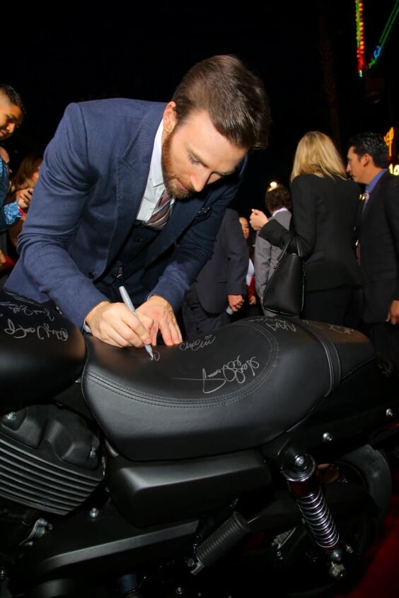 harley davidson invites fan on red carpet at captain america premiere, The Winter Soldier star Chris Evans signs a new Harley Davidson Street 750 at the premiere in Hollywood CA Following the premiere Harley Davidson will donate the bike to Concord Youth Theatre