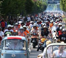 A parade of 10 000 Vespa Scooters for Vespa World Days 2014