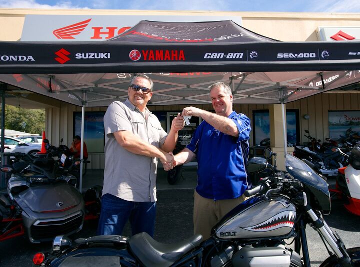 winners of aimexpo 3 way giveaway contest announced, Earl Evans is presented with the keys to a custom Star Motorcycles Bolt R Spec courtesy of Brian Fitzpatrick at Central Florida Powersports