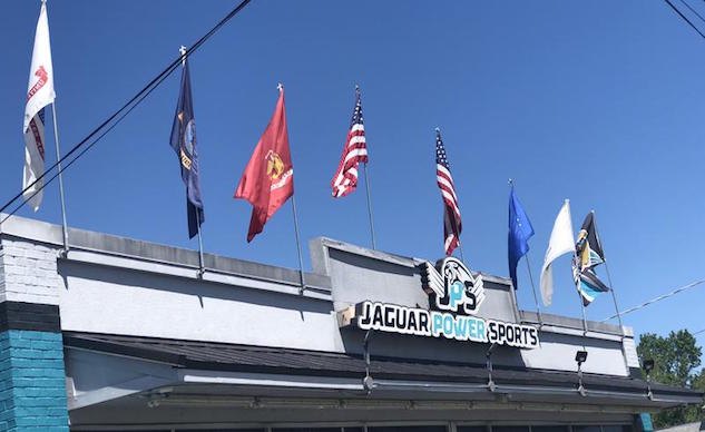 jacksonville fl powersports dealership cited for flying military branch flags