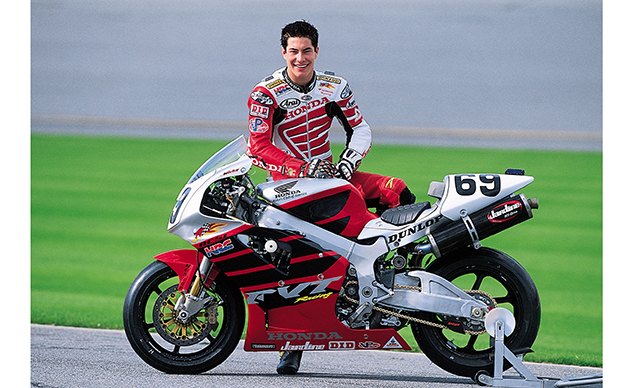 american motorcyclist association american honda pay tribute to nicky hayden with, Nicky Hayden and 2002 Honda RC51 road racing bike