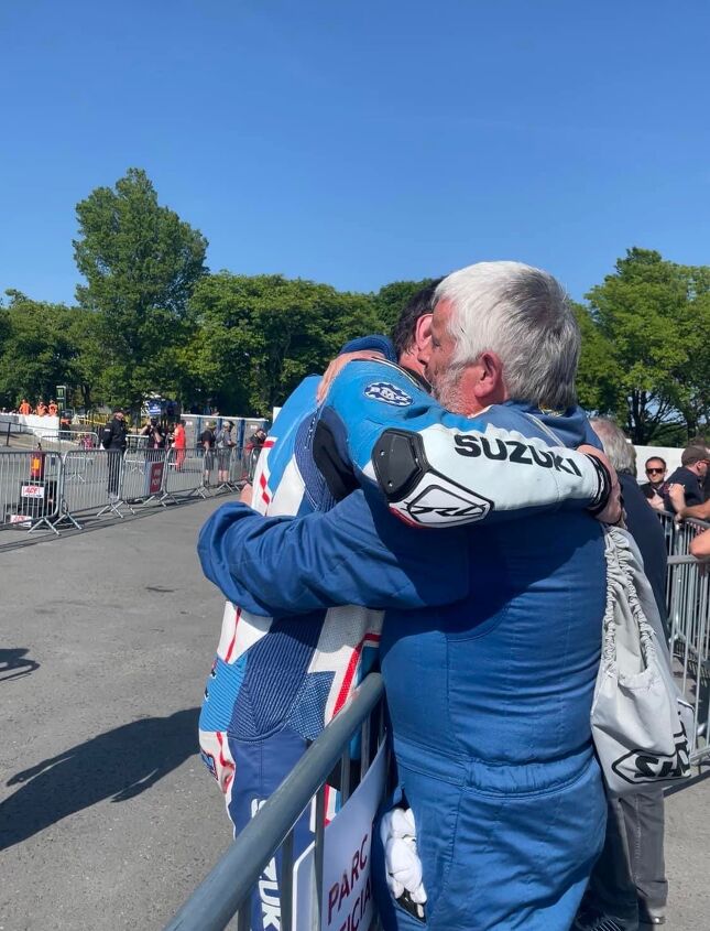 Shaun Anderson and his father Howard embrace after his emotional top ten finish and 130 MPH lap in the Superbike Race. Photo by Sarah Anderson @sarahanderson.photography