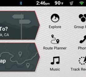 Slightly different but immediately recognizable as a Garmin device. The icons on the menu bar (from left to right) are: GPS signal strength, Bluetooth connection active, time, connection to Tread app active, WiFi signal strength, fuel settings access, and battery status.