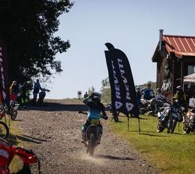 A solo rider returns to basecamp from the trails. Group rides are staged to the right for anyone who wants to try out a trail with some guidance.  Photo: Camille Bolanos