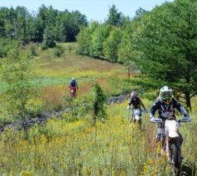 Women ride together through one of the newer trails on the property at Over and Out.  Photo: Sarah Marquet